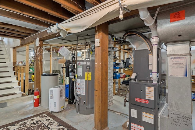 utility room featuring water heater and heating unit