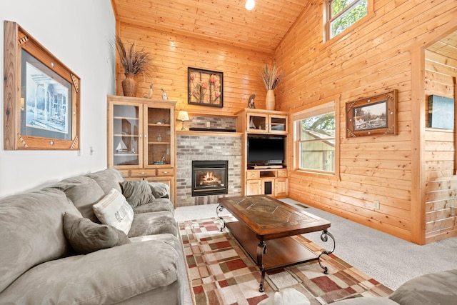 21140 654th Ave, Litchfield, MN 55355 - carpeted living room featuring high vaulted ceiling, wooden walls, a brick fireplace, and wood ceiling