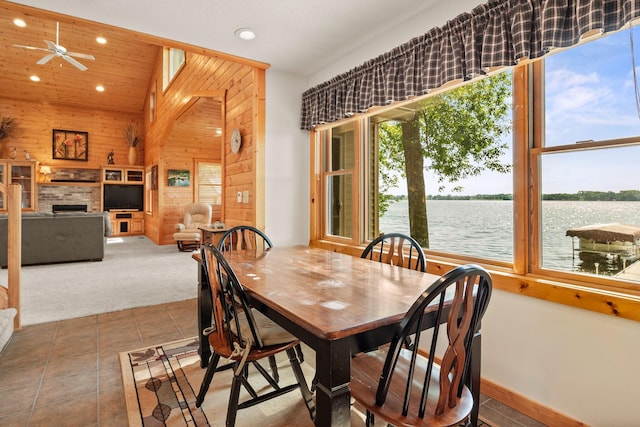 21140 654th Ave, Litchfield, MN 55355 - tiled dining room featuring wood walls, recessed lighting, a fireplace, carpet flooring, and ceiling fan