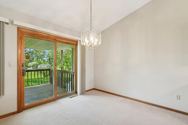 2558 75th St E, Inver Grove Heights, MN 55076 - carpeted spare room with baseboards and a chandelier