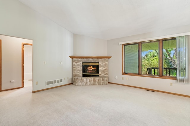 2558 75th St E, Inver Grove Heights, MN 55076 - unfurnished living room featuring carpet and a fireplace