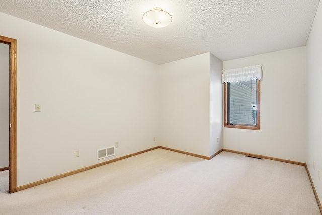 2558 75th St E, Inver Grove Heights, MN 55076 - empty room featuring light colored carpet and a textured ceiling