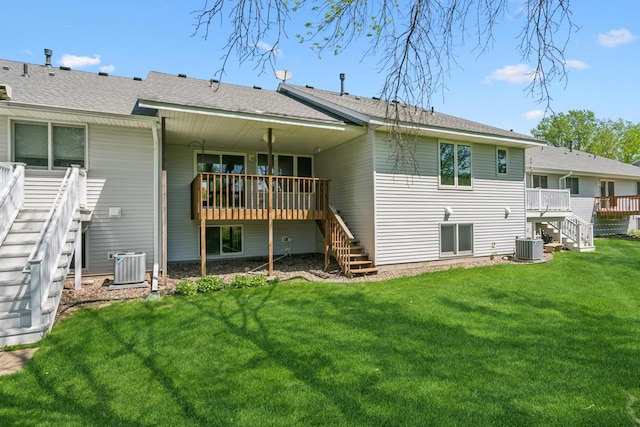 2558 75th St E, Inver Grove Heights, MN 55076 - back of house with stairway, a wooden deck, and a lawn