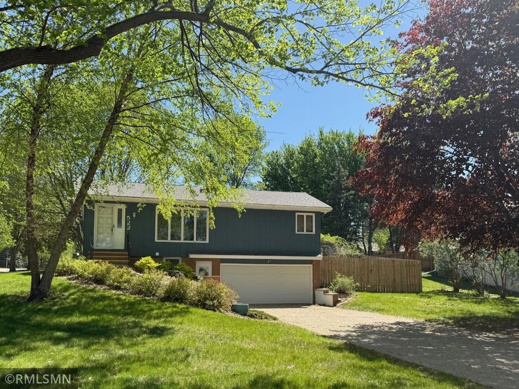 522 Fairview Dr, Luverne, MN 56156 - view of front of house with driveway and a garage