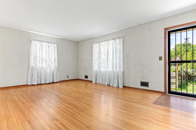 7109 Penn Ave S, Richfield, MN 55423 - spare room featuring wood finished floors and baseboards