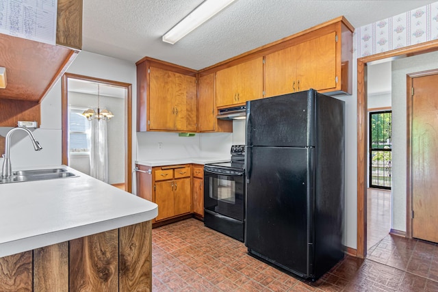 7109 Penn Ave S, Richfield, MN 55423 - kitchen featuring black appliances, brick patterned flooring, a sink, wallpapered walls, and brown cabinets