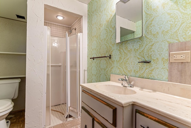 7109 Penn Ave S, Richfield, MN 55423 - bathroom with toilet, vanity, a stall shower, tile patterned floors, and wallpapered walls