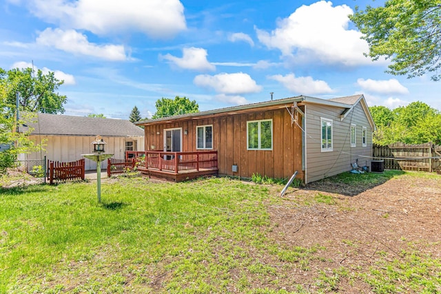 7109 Penn Ave S, Richfield, MN 55423 - back of house with a wooden deck, central AC unit, and board and batten siding