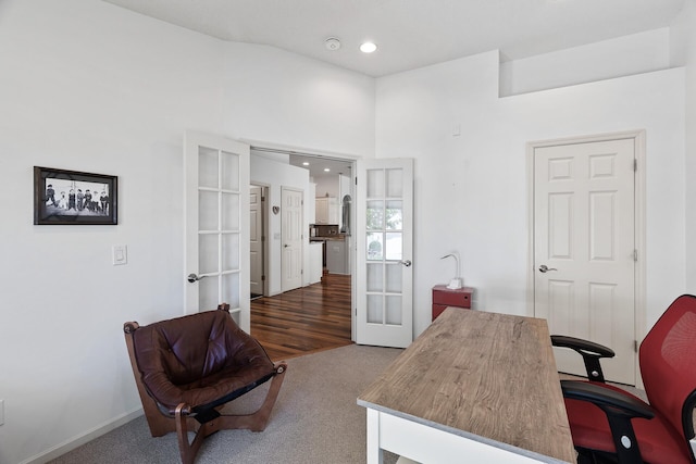 carpeted home office featuring french doors and recessed lighting