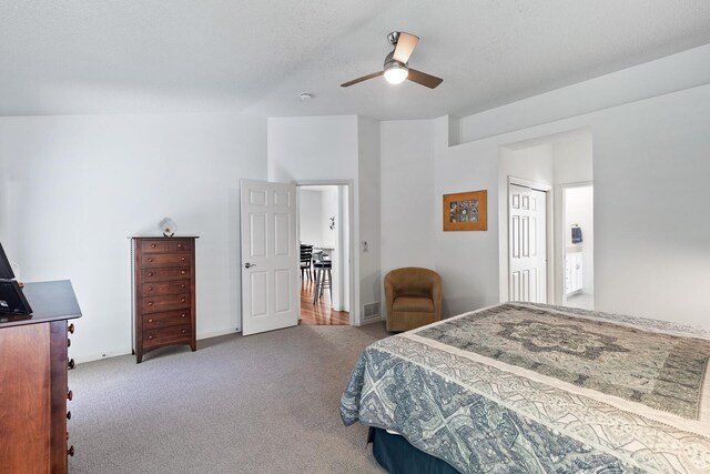 bedroom with carpet floors, a ceiling fan, a closet, and baseboards