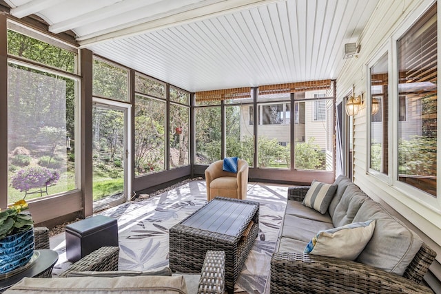 sunroom / solarium with plenty of natural light and outdoor lounge area