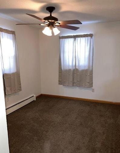 7673 River Rd, Fridley, MN 55432 - empty room featuring baseboard heating, carpet, a ceiling fan, and baseboards