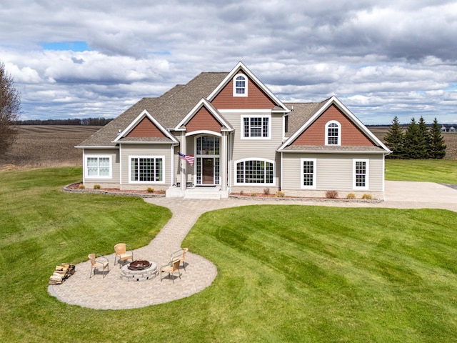 37854 210th Ave SE, Knute Twp, MN 56535 - rear view of property with an outdoor fire pit, a yard, and roof with shingles