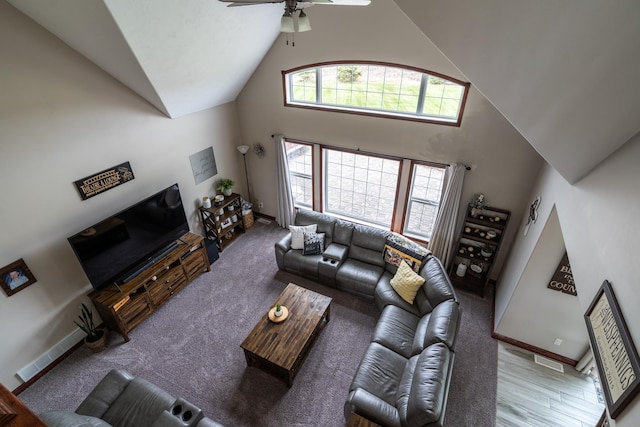 37854 210th Ave SE, Knute Twp, MN 56535 - living room featuring high vaulted ceiling, a ceiling fan, and baseboards