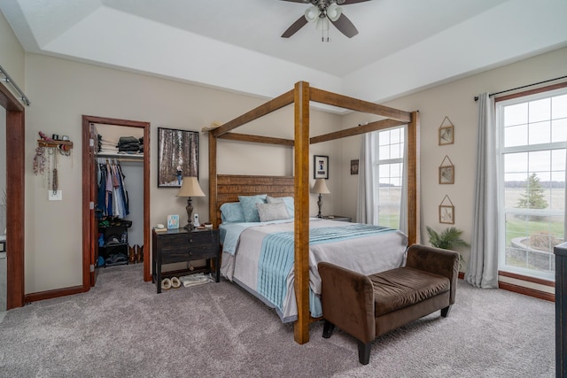 37854 210th Ave SE, Knute Twp, MN 56535 - carpeted bedroom with a spacious closet, a closet, baseboards, and ceiling fan