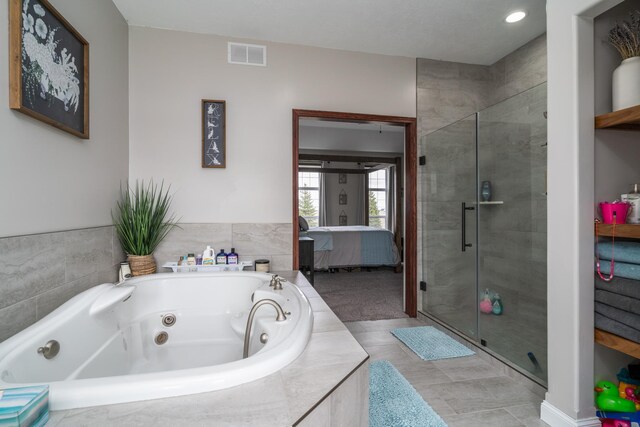 37854 210th Ave SE, Knute Twp, MN 56535 - ensuite bathroom featuring a stall shower and a tub with jets