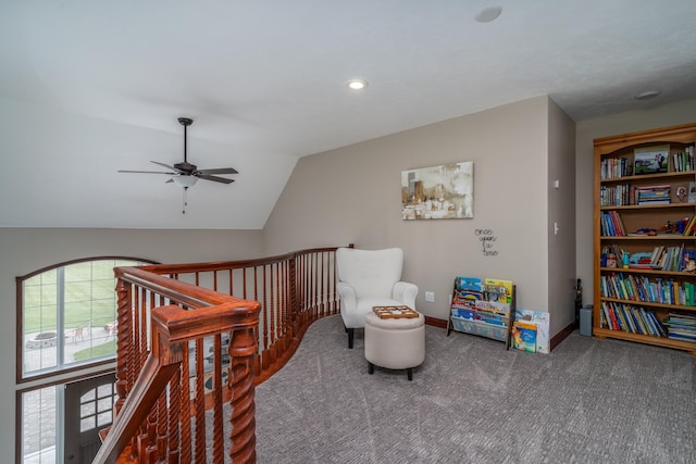 37854 210th Ave SE, Knute Twp, MN 56535 - living area featuring an upstairs landing, a ceiling fan, carpet, vaulted ceiling, and baseboards