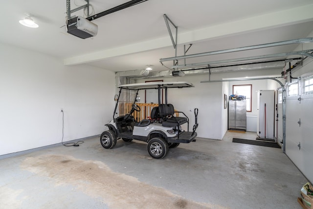 37854 210th Ave SE, Knute Twp, MN 56535 - garage with a garage door opener and freestanding refrigerator