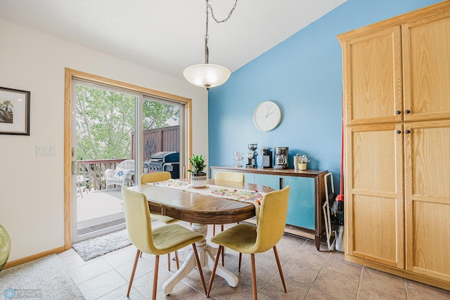 dining space with light tile patterned floors