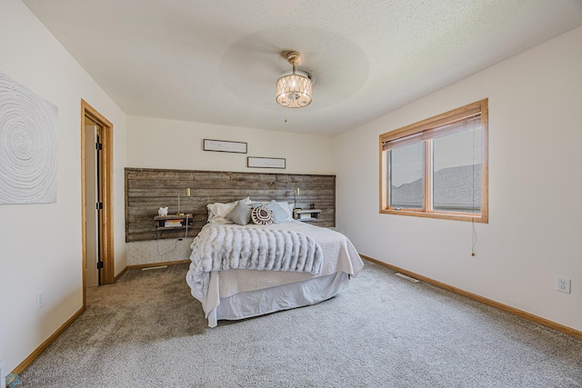 bedroom featuring carpet floors, baseboards, and a ceiling fan