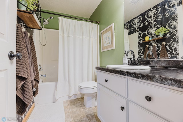 bathroom with vanity, toilet, and shower / bath combo