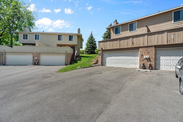 2111 Tamarin Trl, Golden Valley, MN 55427 - view of front of property with a chimney and brick siding