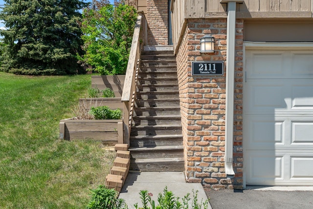 2111 Tamarin Trl, Golden Valley, MN 55427 - doorway to property with a lawn, board and batten siding, and brick siding