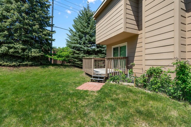 2111 Tamarin Trl, Golden Valley, MN 55427 - view of green lawn featuring a wooden deck