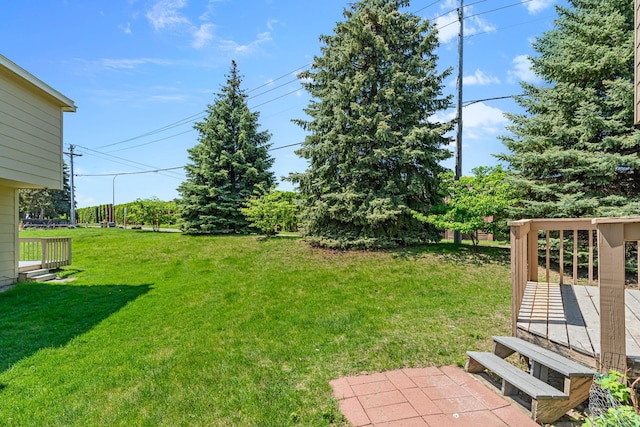 2111 Tamarin Trl, Golden Valley, MN 55427 - view of green lawn featuring a wooden deck