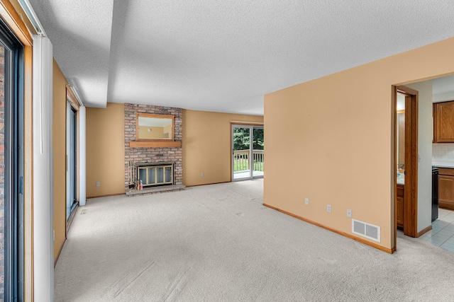 2111 Tamarin Trl, Golden Valley, MN 55427 - unfurnished living room with a textured ceiling, a brick fireplace, light carpet, and baseboards