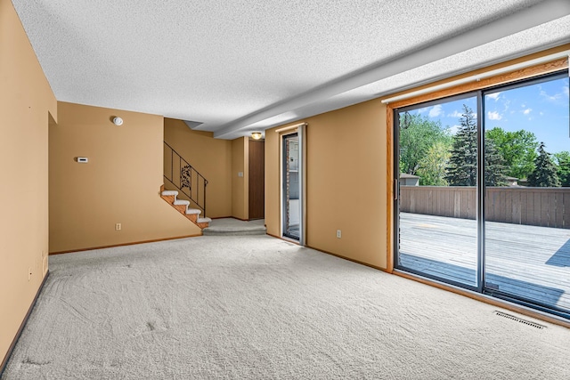 2111 Tamarin Trl, Golden Valley, MN 55427 - carpeted empty room with a textured ceiling, stairway, and baseboards