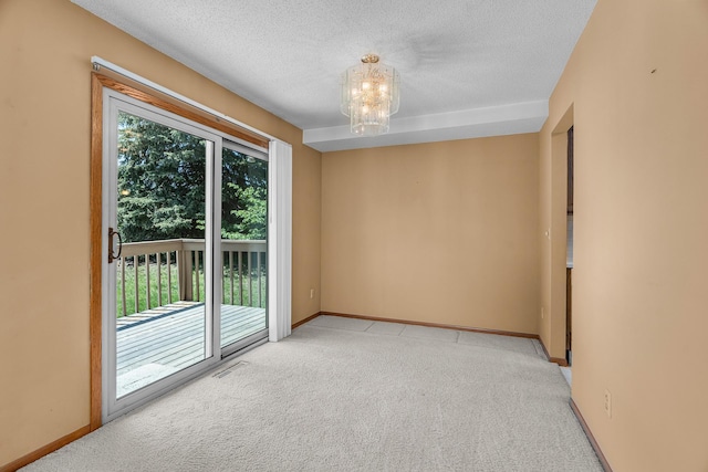 2111 Tamarin Trl, Golden Valley, MN 55427 - unfurnished room with light colored carpet, a textured ceiling, a chandelier, and baseboards