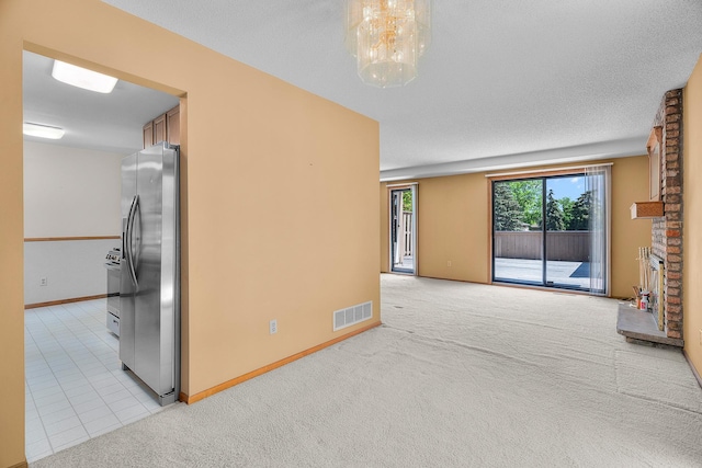 2111 Tamarin Trl, Golden Valley, MN 55427 - empty room with light colored carpet, baseboards, and a chandelier