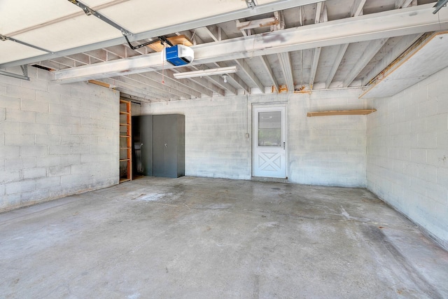 2111 Tamarin Trl, Golden Valley, MN 55427 - garage with a garage door opener and concrete block wall
