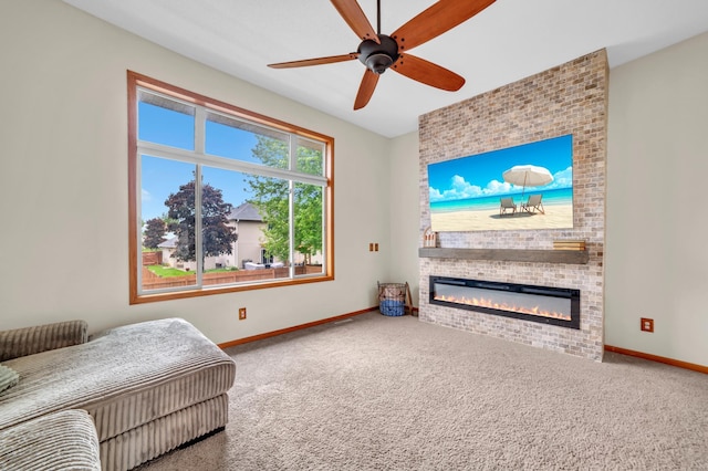 13883 Holly St NW, Andover, MN 55304 - carpeted living room featuring baseboards, a large fireplace, and ceiling fan