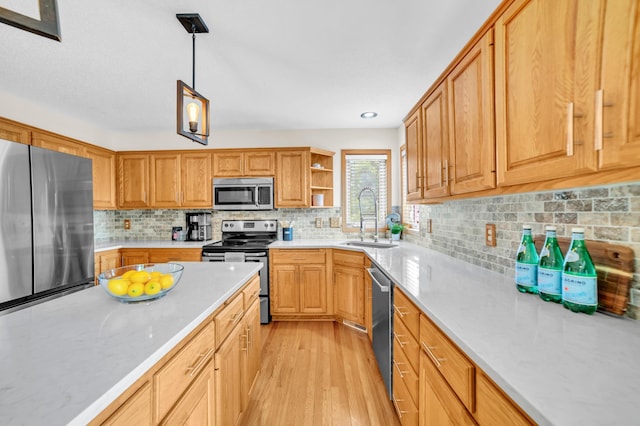 13883 Holly St NW, Andover, MN 55304 - kitchen featuring stainless steel appliances, a sink, light wood-style floors, decorative backsplash, and open shelves