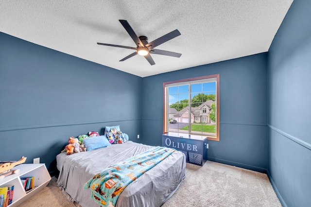 13883 Holly St NW, Andover, MN 55304 - carpeted bedroom featuring a textured ceiling, ceiling fan, and baseboards