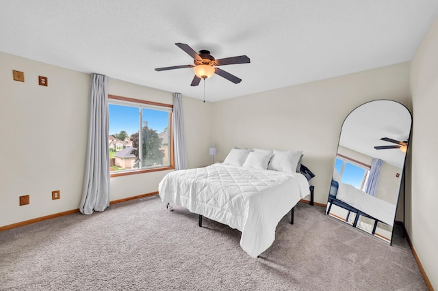13883 Holly St NW, Andover, MN 55304 - carpeted bedroom with baseboards and ceiling fan