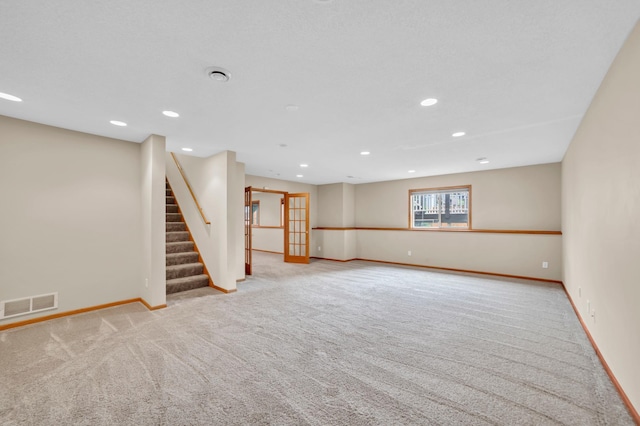 13883 Holly St NW, Andover, MN 55304 - below grade area featuring carpet flooring, baseboards, stairway, and recessed lighting