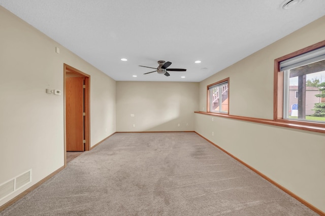 13883 Holly St NW, Andover, MN 55304 - carpeted spare room with plenty of natural light, ceiling fan, baseboards, and recessed lighting