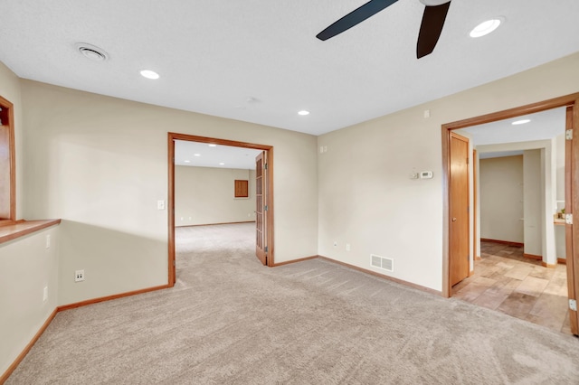 13883 Holly St NW, Andover, MN 55304 - empty room with a ceiling fan, light colored carpet, baseboards, and recessed lighting