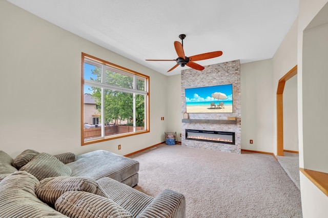 13883 Holly St NW, Andover, MN 55304 - living area with carpet floors, a ceiling fan, baseboards, and a fireplace