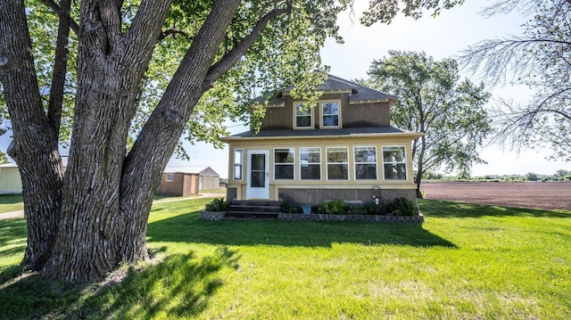 23142 Denmark Ave, Castle Rock Twp, MN 55024 - view of front of home featuring entry steps, a front yard, and stucco siding