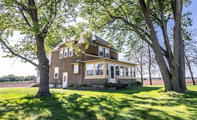 23142 Denmark Ave, Castle Rock Twp, MN 55024 - view of front of house with a front lawn, stucco siding, and entry steps