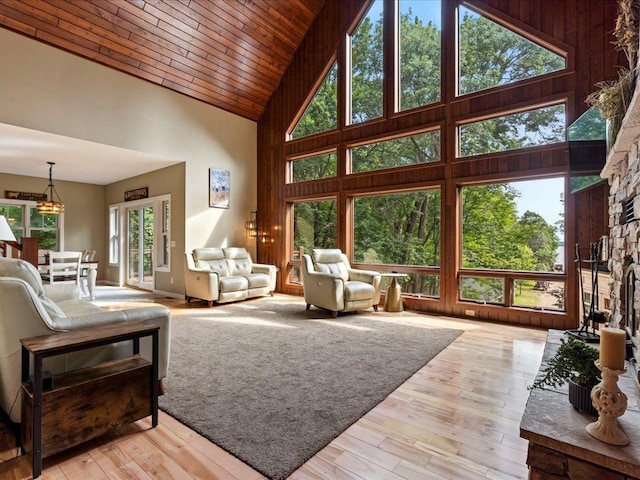 26746 County Road 4, Nisswa, MN 56468 - living area featuring high vaulted ceiling, wooden ceiling, and light wood-style flooring