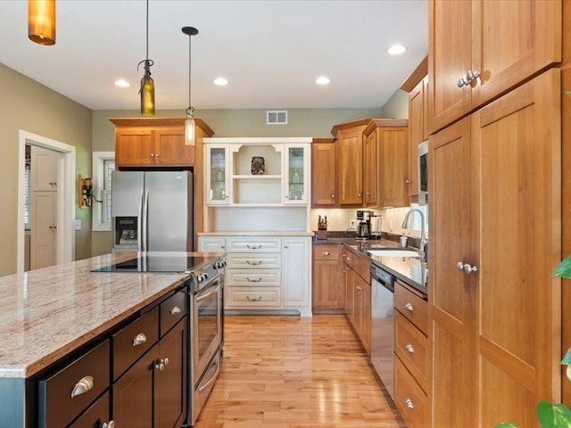 26746 County Road 4, Nisswa, MN 56468 - kitchen with stainless steel appliances, a sink, open shelves, light wood-style floors, and light stone counters