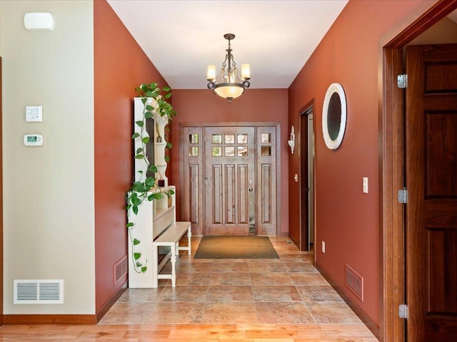 26746 County Road 4, Nisswa, MN 56468 - foyer with a chandelier and baseboards