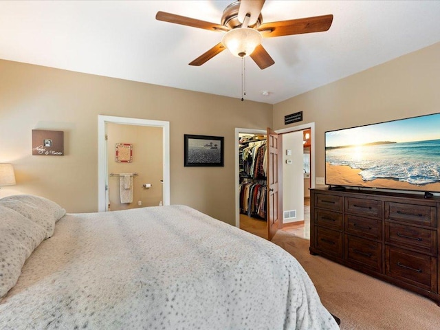 26746 County Road 4, Nisswa, MN 56468 - bedroom featuring a spacious closet, light colored carpet, ensuite bath, a closet, and a ceiling fan