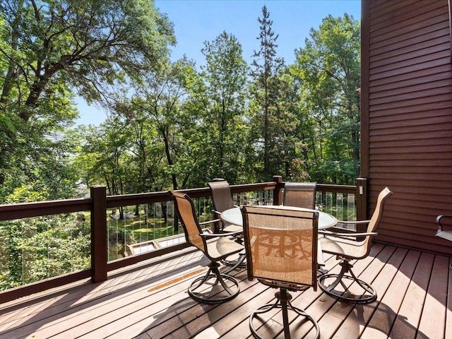 26746 County Road 4, Nisswa, MN 56468 - wooden deck featuring outdoor dining area