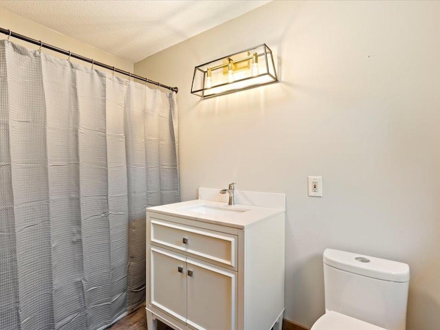 26746 County Road 4, Nisswa, MN 56468 - full bath with toilet, vanity, a textured ceiling, and a shower with curtain